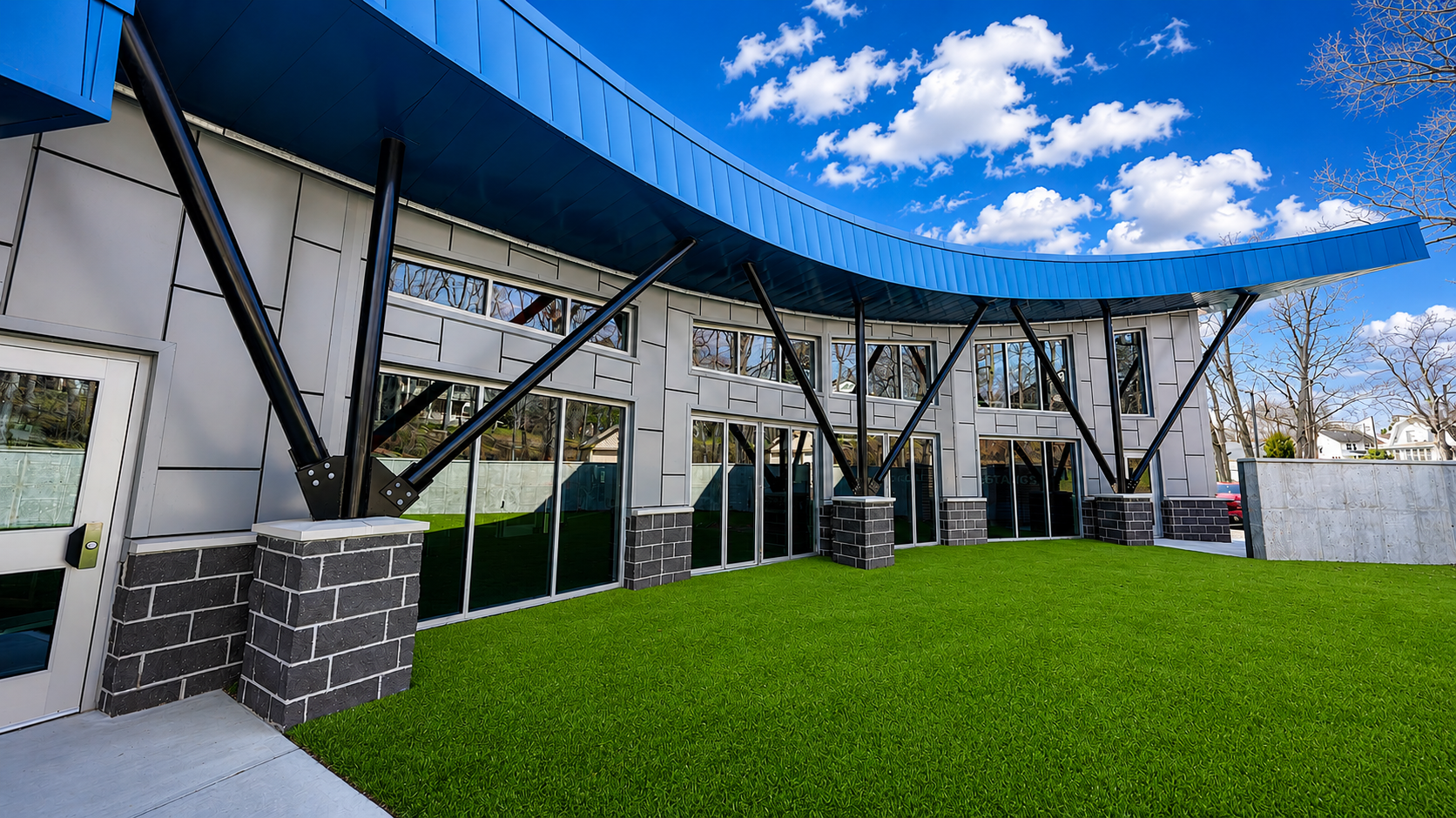 Curved-roof athletic turf facility built by Iversen Construction